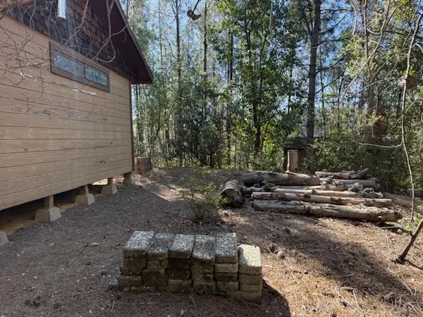 a view of backyard with outdoor seating