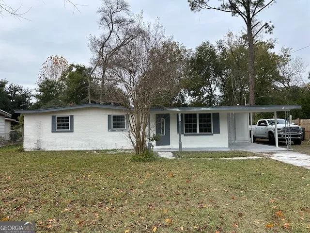 a house that has a tree in front of it