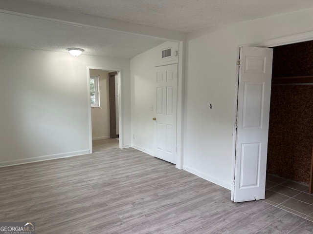527 Carteret Road Brunswick, GA 31525 - Photo 13 of 23 a view of an empty room with wooden floor and closet