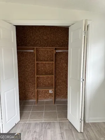 a bathroom with a shower and a sink
