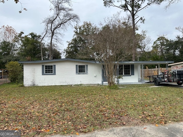 527 Carteret Road Brunswick, GA 31525 - Photo 23 of 23 a view of a house with backyard