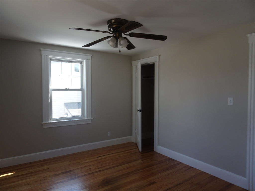 26 Hobson Street Methuen, MA 01844 - Photo 18 of 26 a view of an empty room with wooden floor and a window