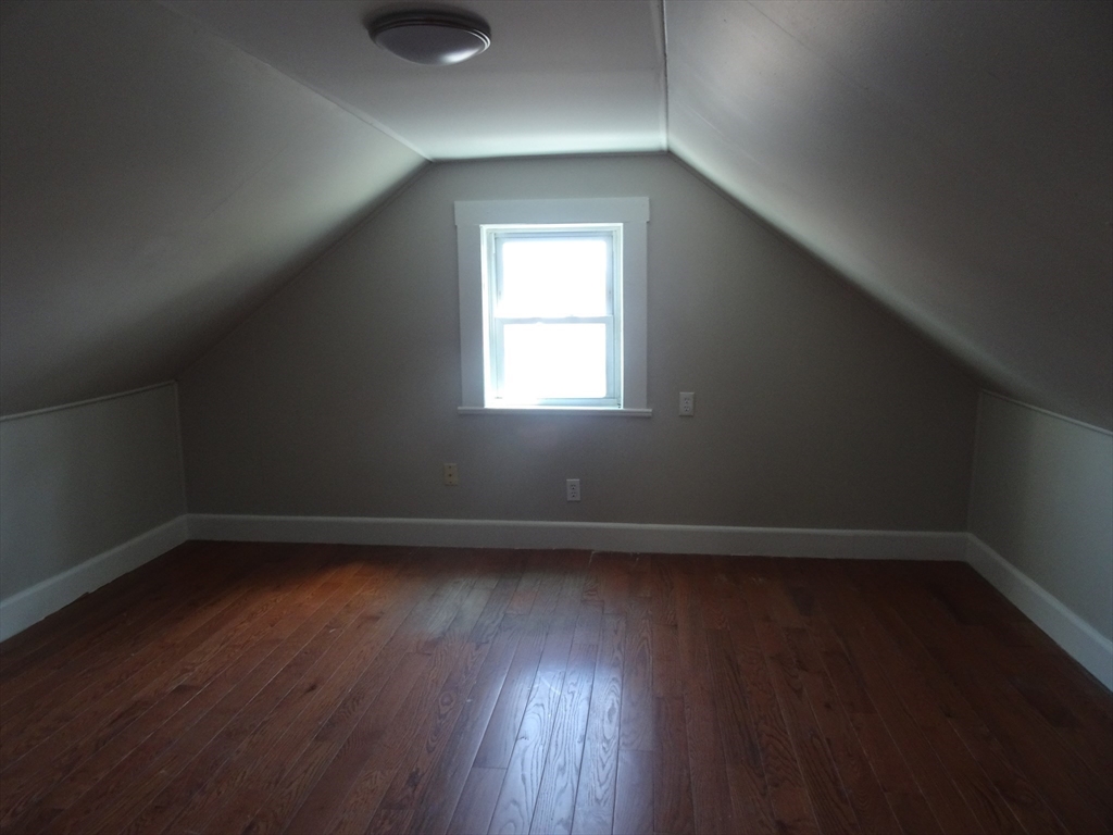 26 Hobson Street Methuen, MA 01844 - Photo 21 of 26 an empty room with wooden floor and windows