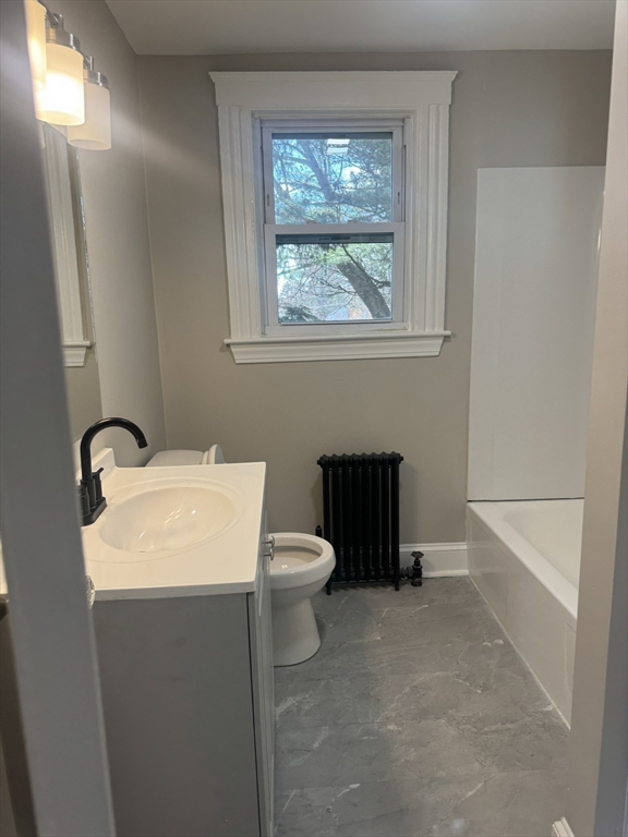 26 Hobson Street Methuen, MA 01844 - Photo 8 of 26 a bathroom with a toilet sink and window