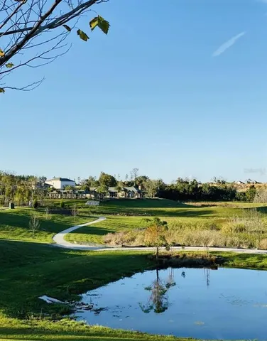 a view of a swimming pool and a yard