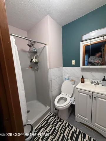 a bathroom with a toilet and a sink