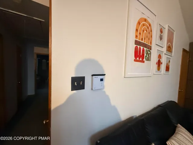 a view of entryway with furniture and a fireplace