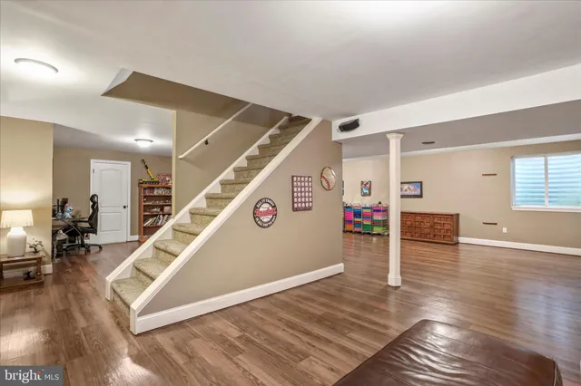 a view of entryway and hall with wooden floor