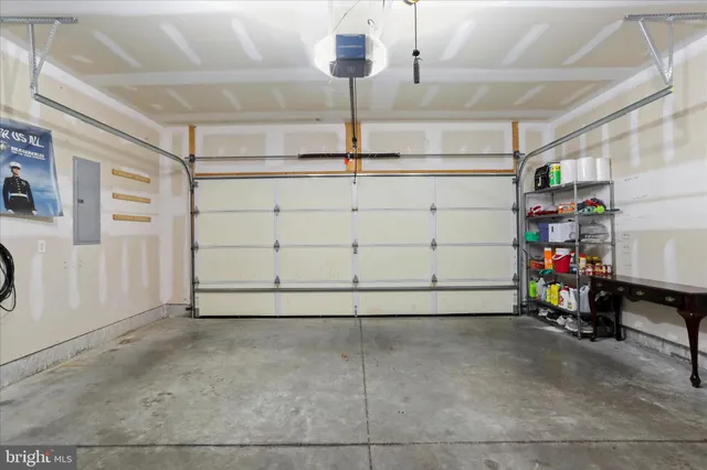 a view of a garage with rack and bicycle