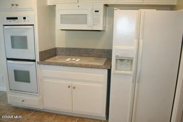a utility room with washer and dryer