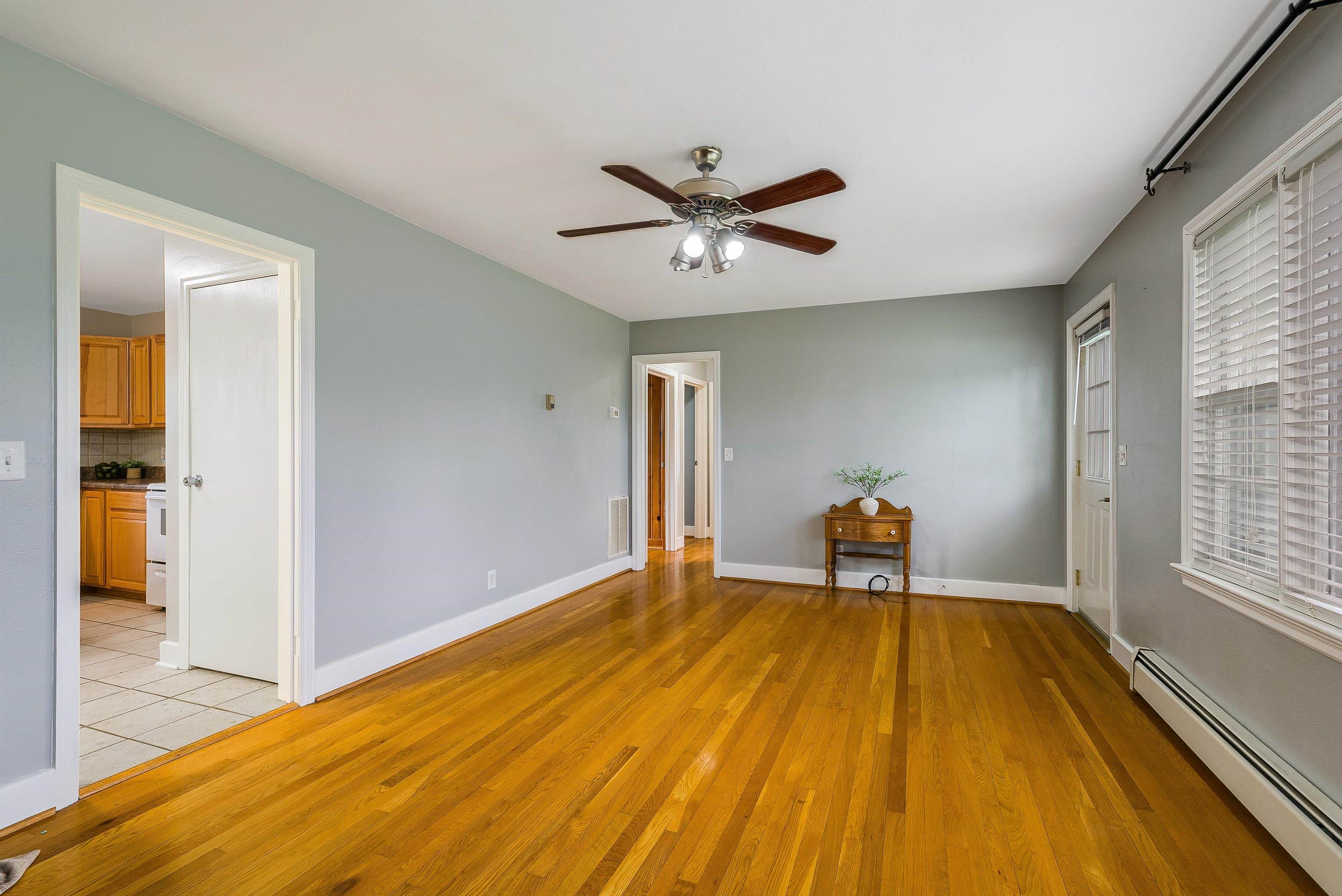 78 Stuart Avenue Stuarts Draft, VA 24477 - Photo 11 of 41 a bedroom with a bed and wooden floor