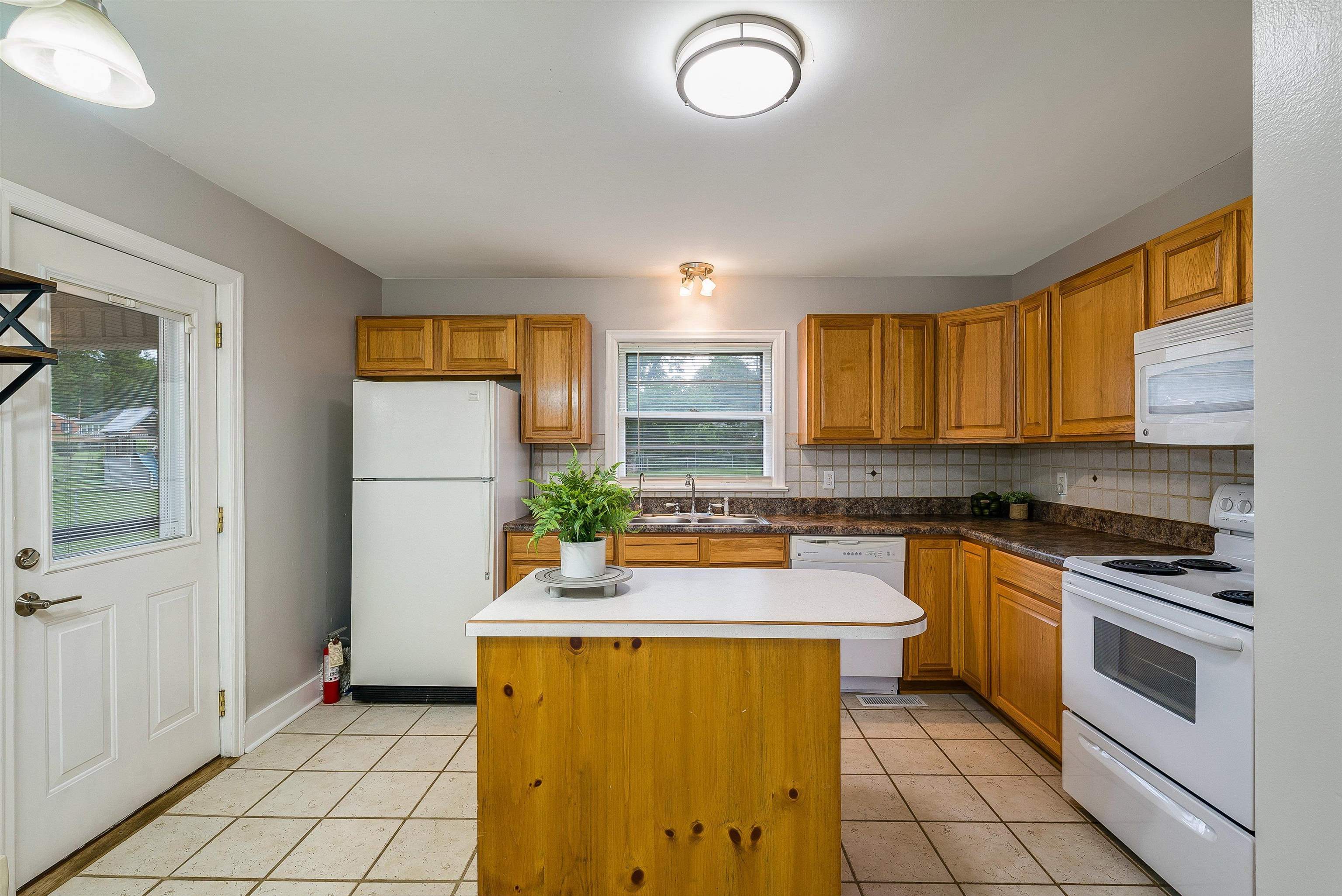 78 Stuart Avenue Stuarts Draft, VA 24477 - Photo 12 of 41 a kitchen with a sink appliances and cabinets