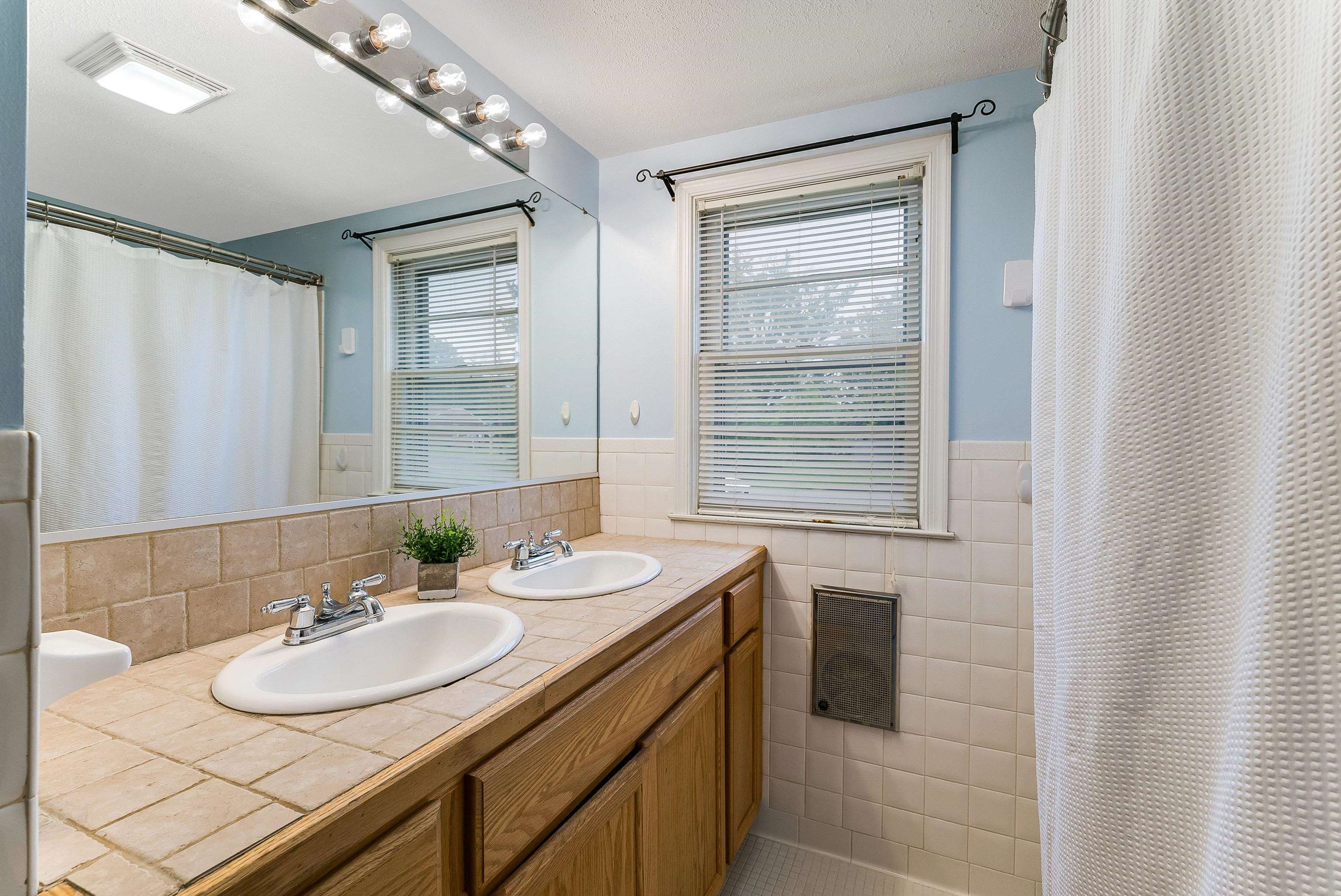 78 Stuart Avenue Stuarts Draft, VA 24477 - Photo 23 of 41 a bathroom with a sink double vanity and a mirror