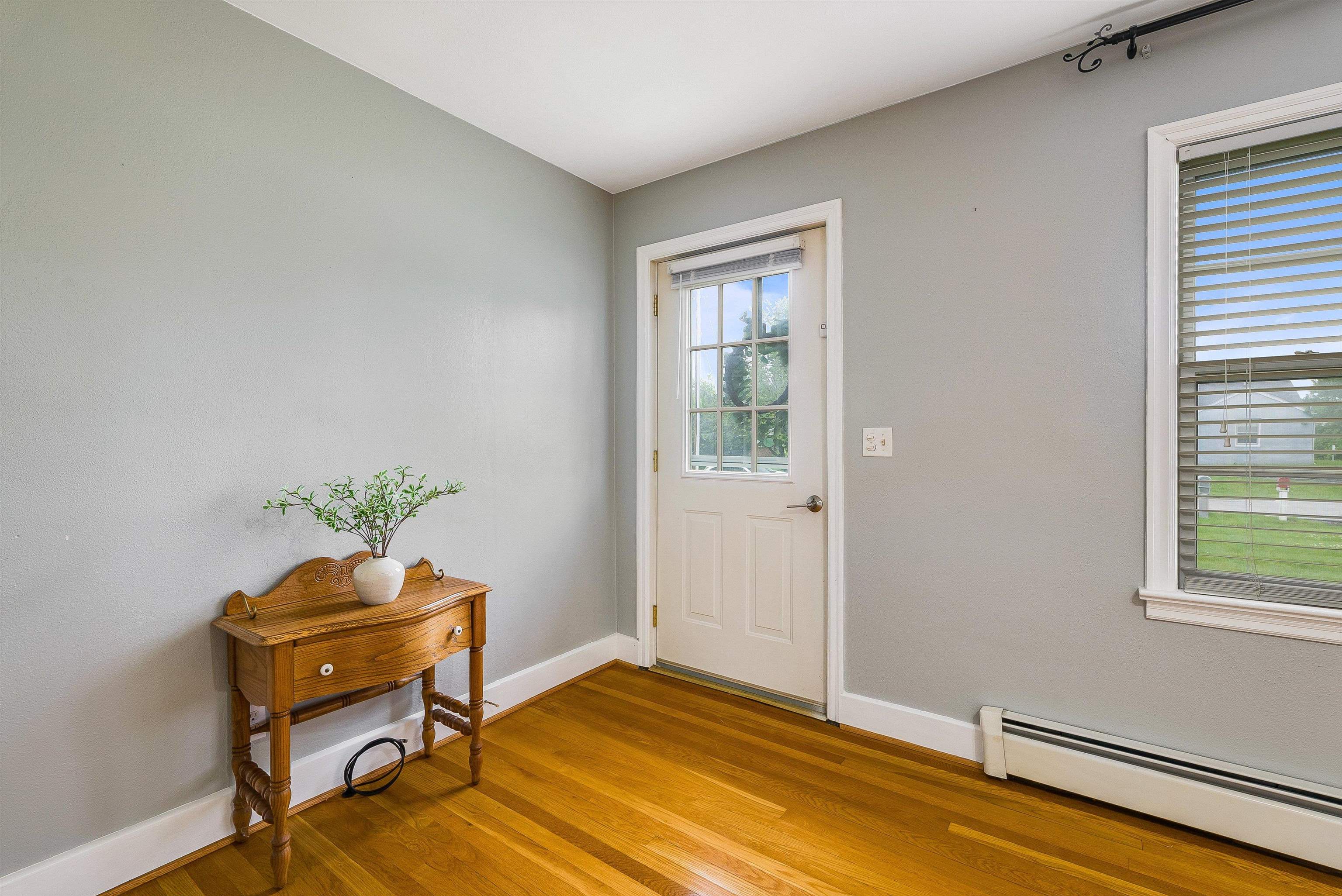 78 Stuart Avenue Stuarts Draft, VA 24477 - Photo 7 of 41 a living room with a piano and a window