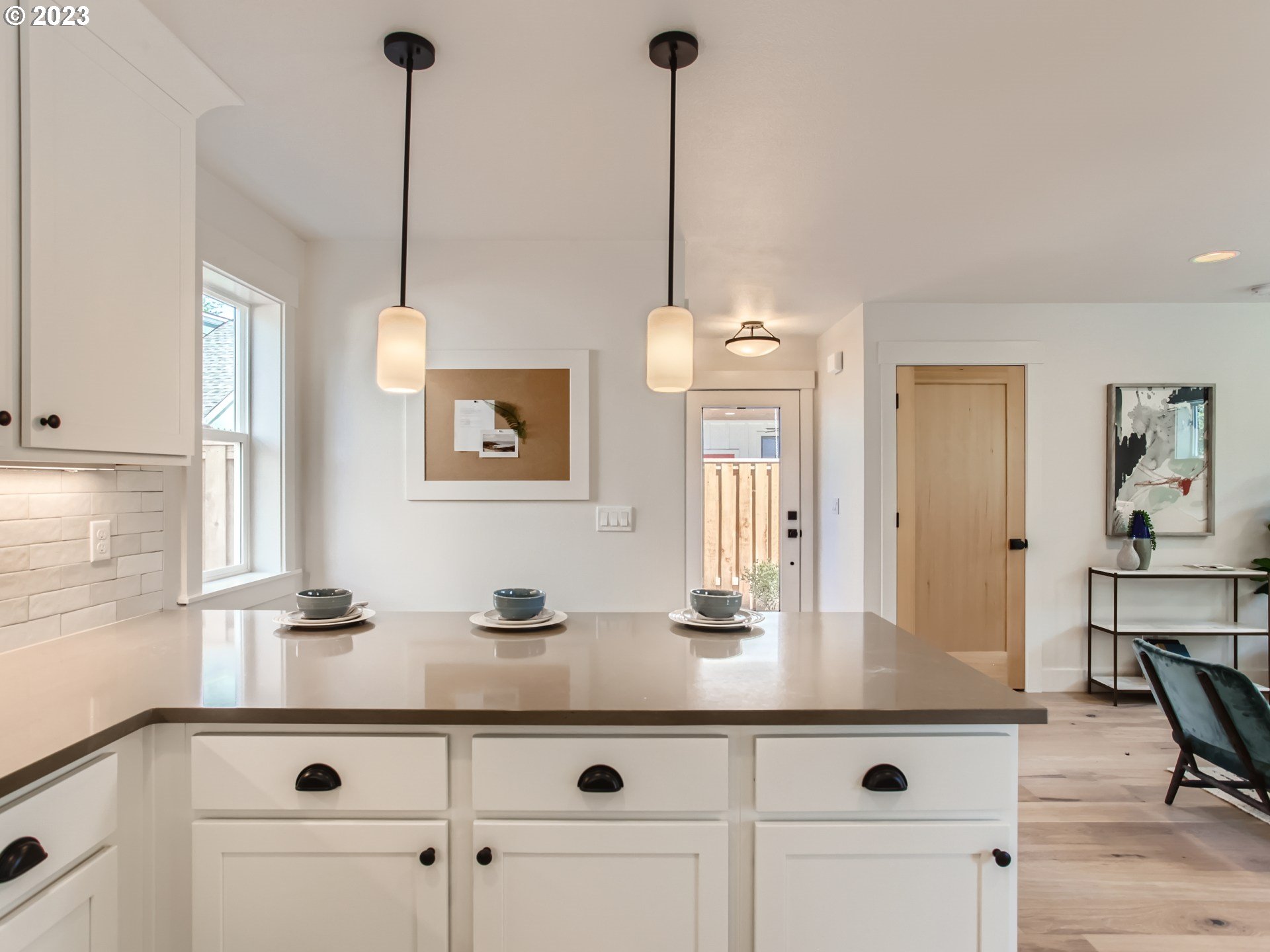 3134 North Winchell Street, Unit B Portland, OR 97217 - Photo 12 of 24 a kitchen with a sink and chandelier