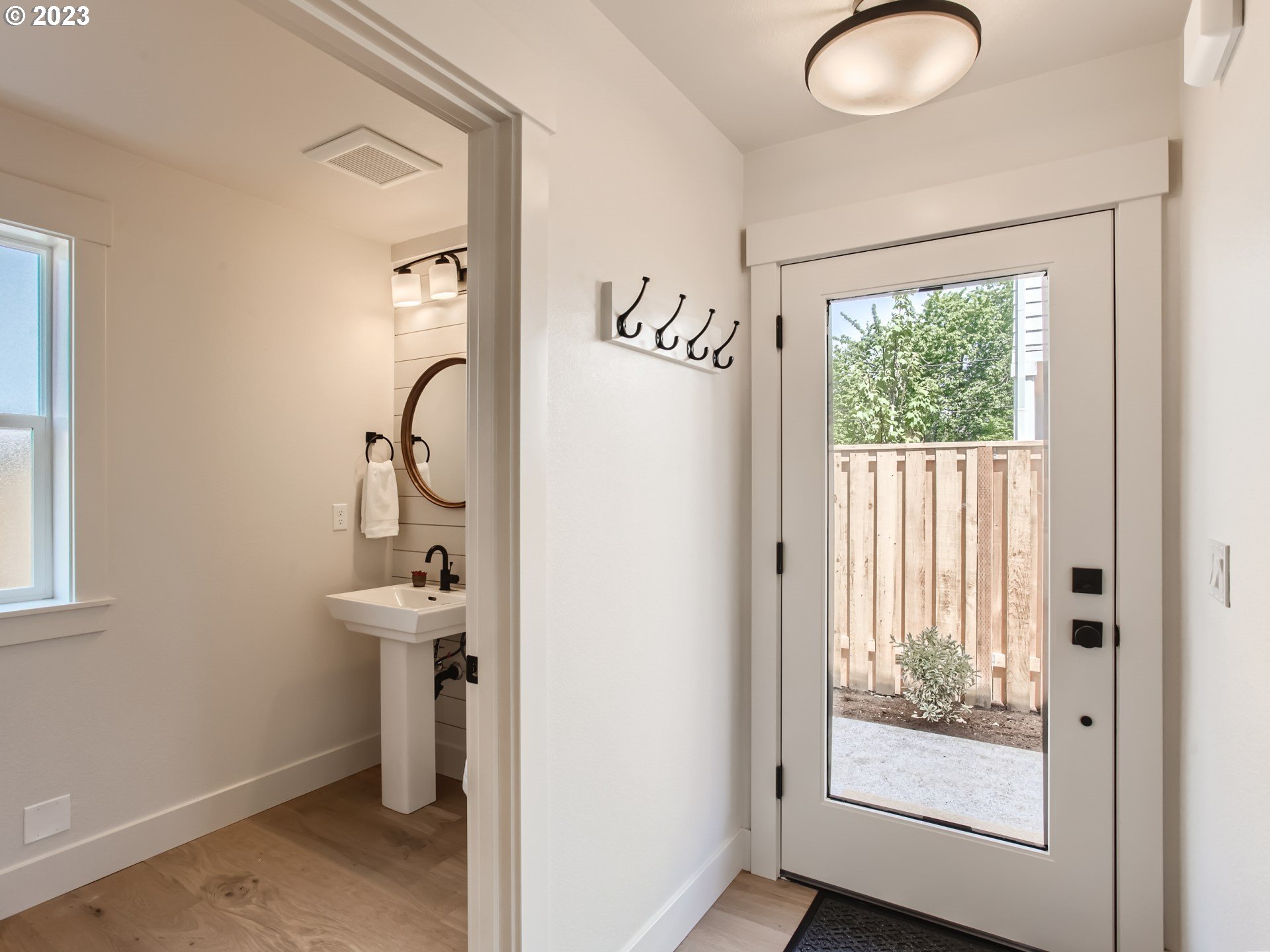 3134 North Winchell Street, Unit B Portland, OR 97217 - Photo 13 of 24 a view of a bathroom with a sink and mirror