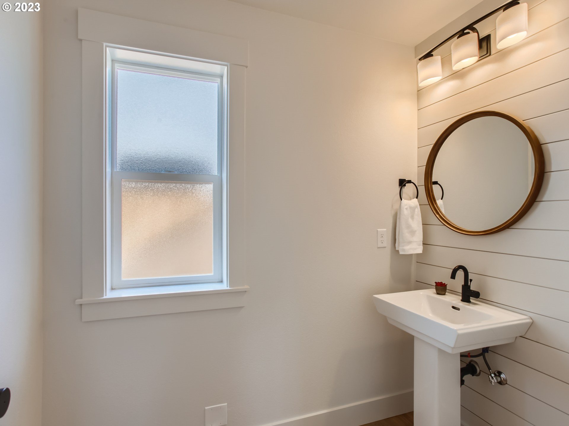 3134 North Winchell Street, Unit B Portland, OR 97217 - Photo 14 of 24 a bathroom with a sink and a mirror