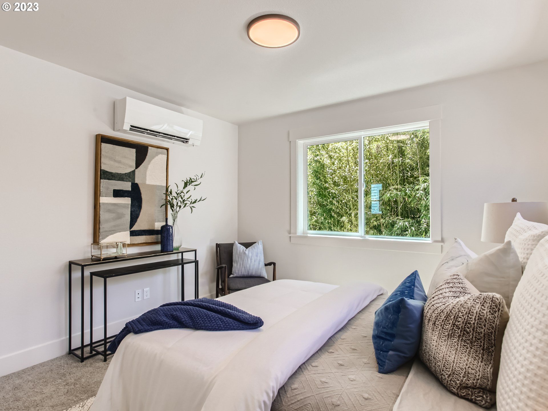 3134 North Winchell Street, Unit B Portland, OR 97217 - Photo 16 of 24 a bedroom with a bed and a window
