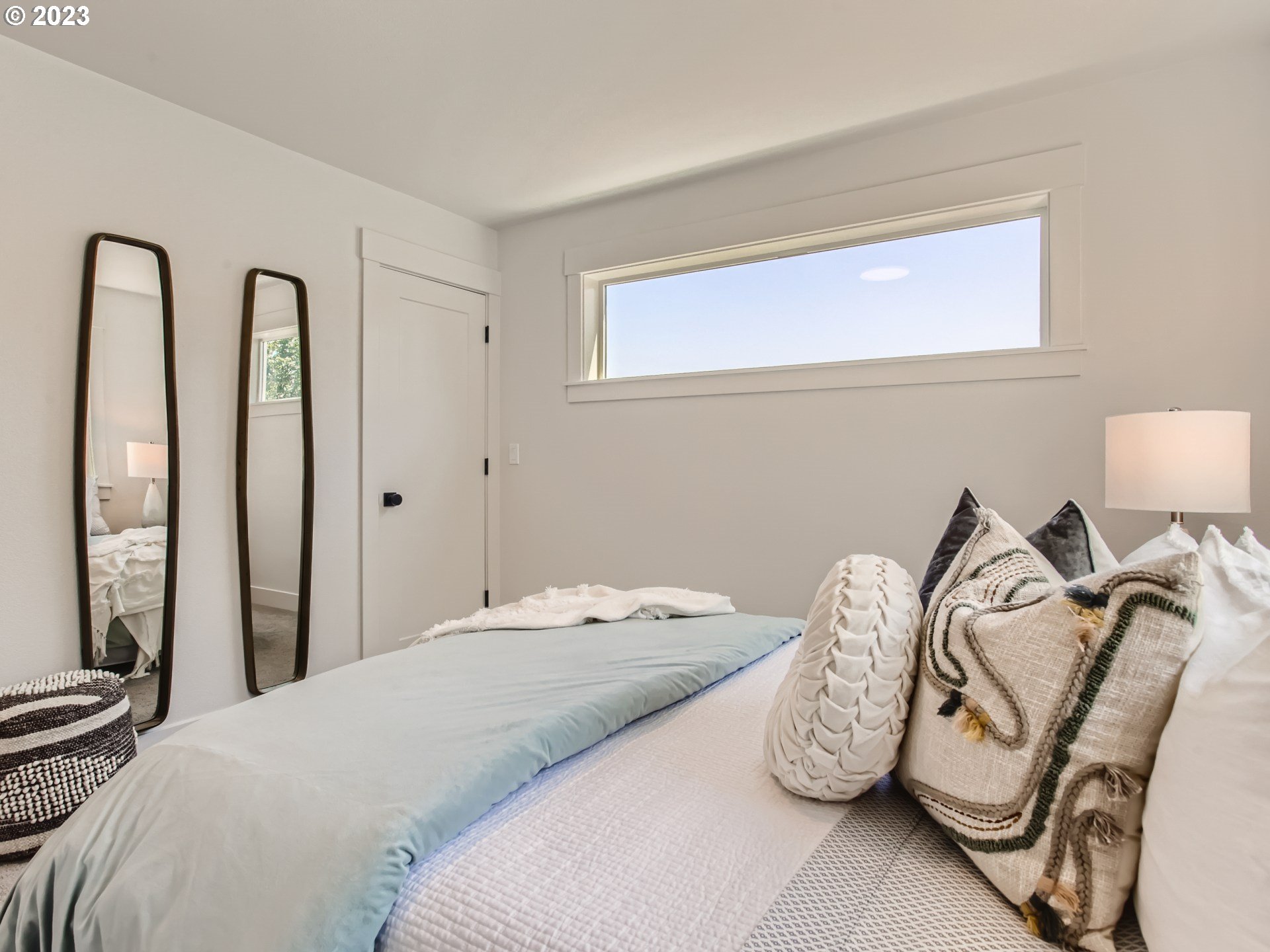 3134 North Winchell Street, Unit B Portland, OR 97217 - Photo 19 of 24 a bedroom with a bed and dresser