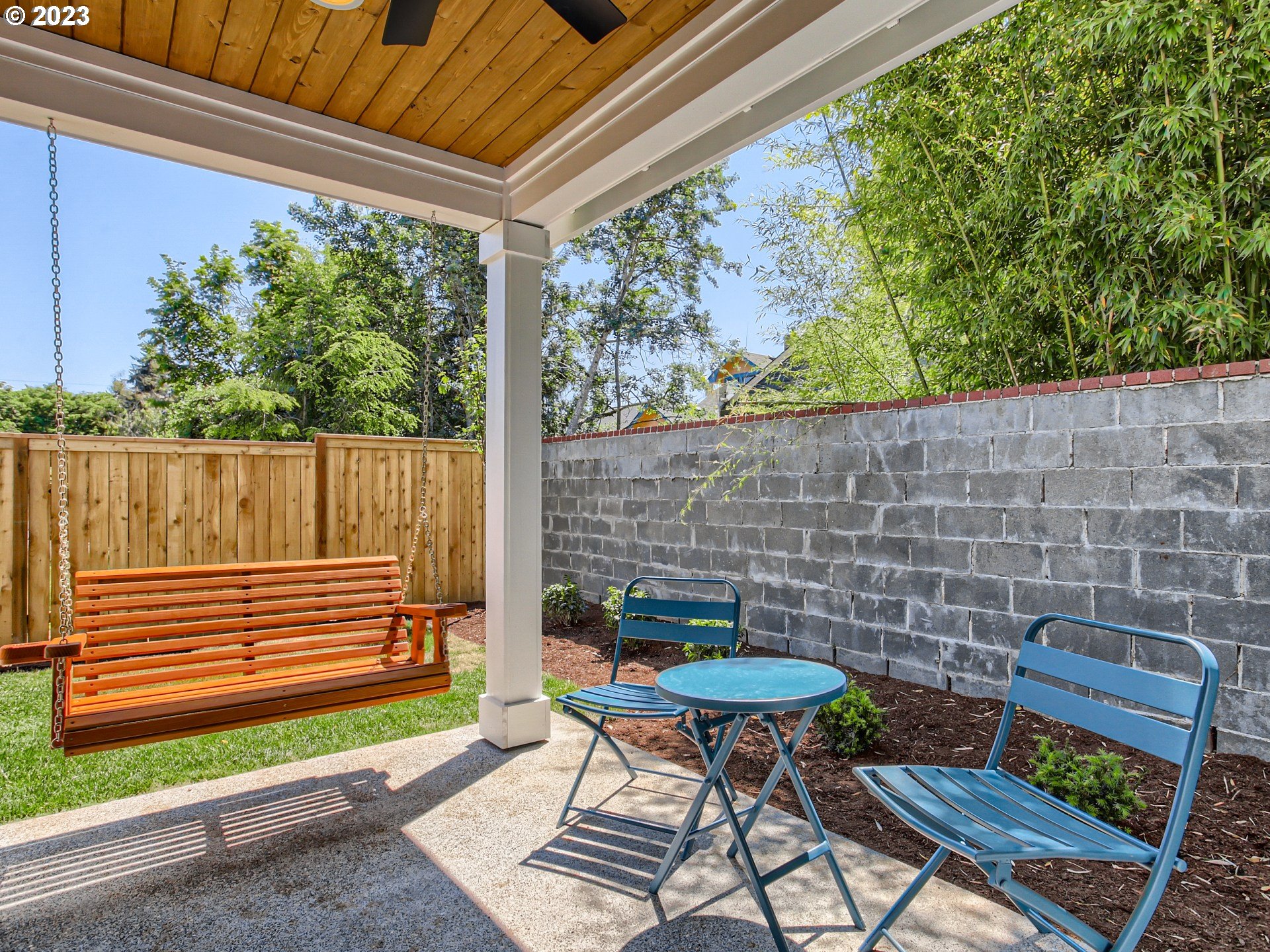 3134 North Winchell Street, Unit B Portland, OR 97217 - Photo 22 of 24 a backyard of a house with table and chairs