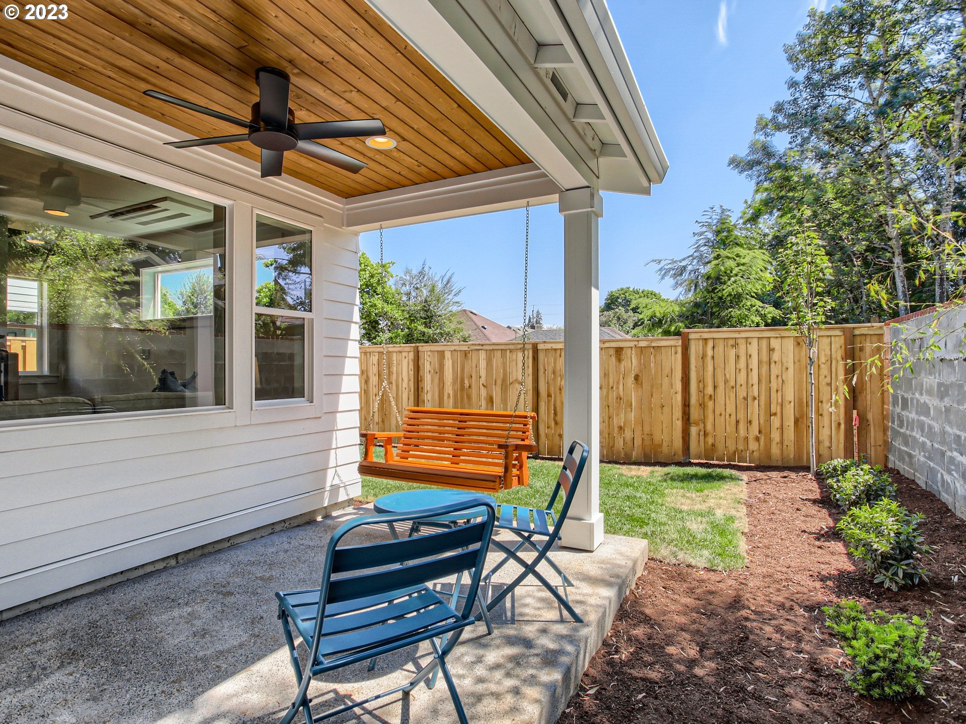 3134 North Winchell Street, Unit B Portland, OR 97217 - Photo 24 of 24 a blue bench sitting in front of a building