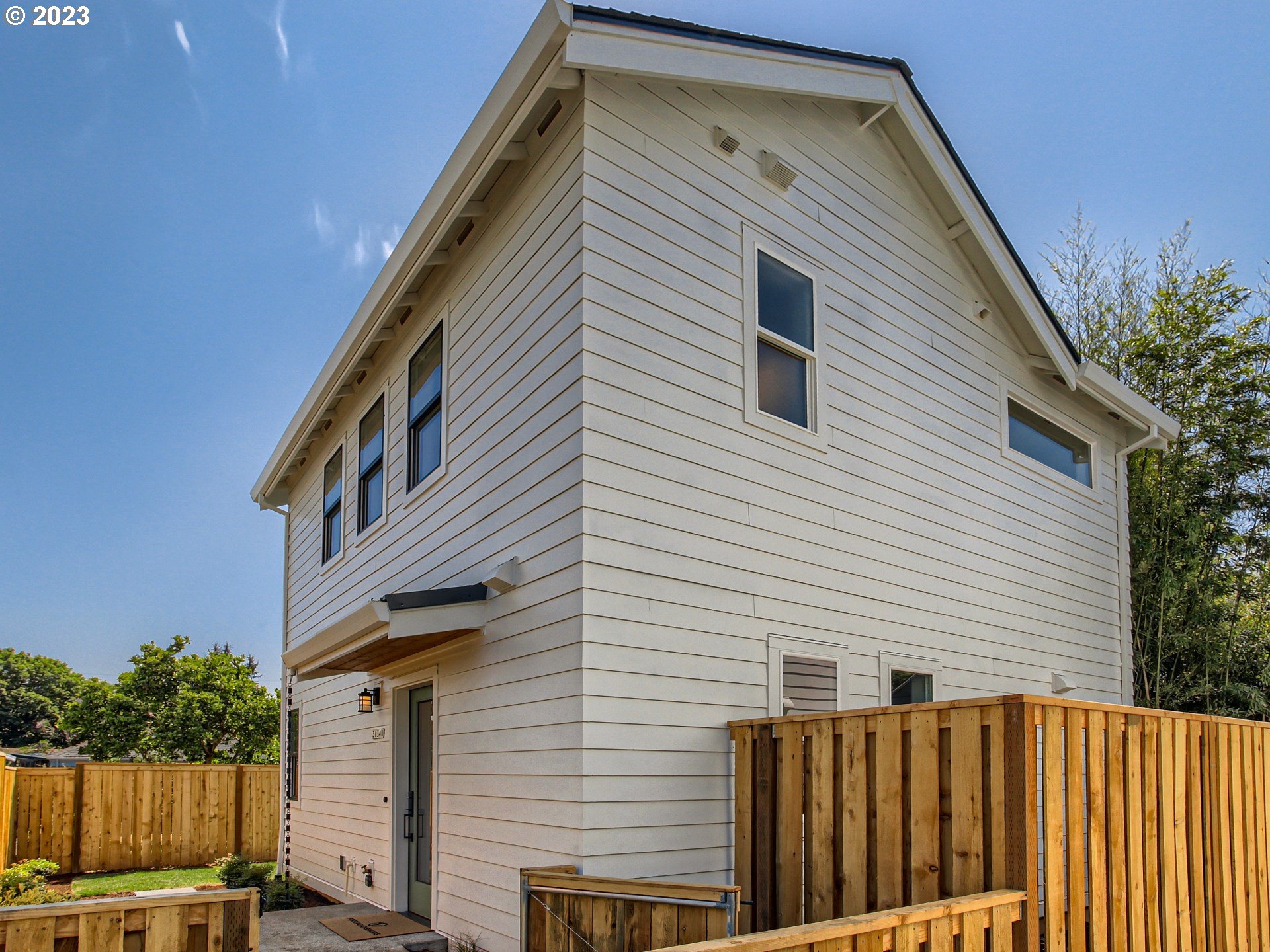 3134 North Winchell Street, Unit B Portland, OR 97217 - Photo 3 of 24 a view of a house with a yard
