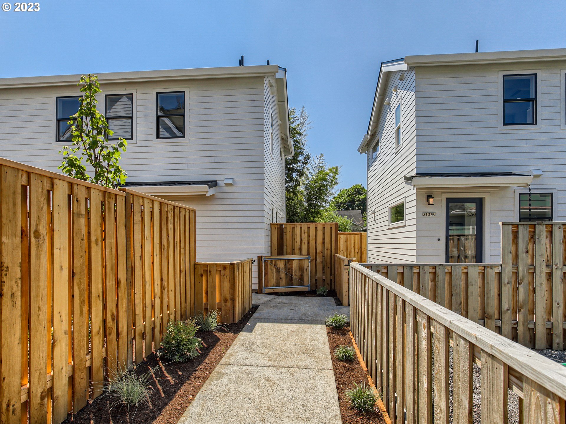 3134 North Winchell Street, Unit B Portland, OR 97217 - Photo 5 of 24 a view of a house with wooden fence