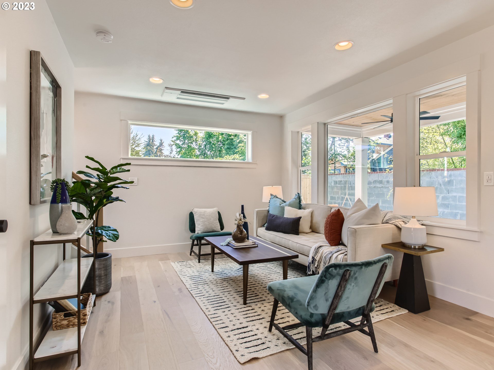 3134 North Winchell Street, Unit B Portland, OR 97217 - Photo 7 of 24 a living room with furniture and a potted plant