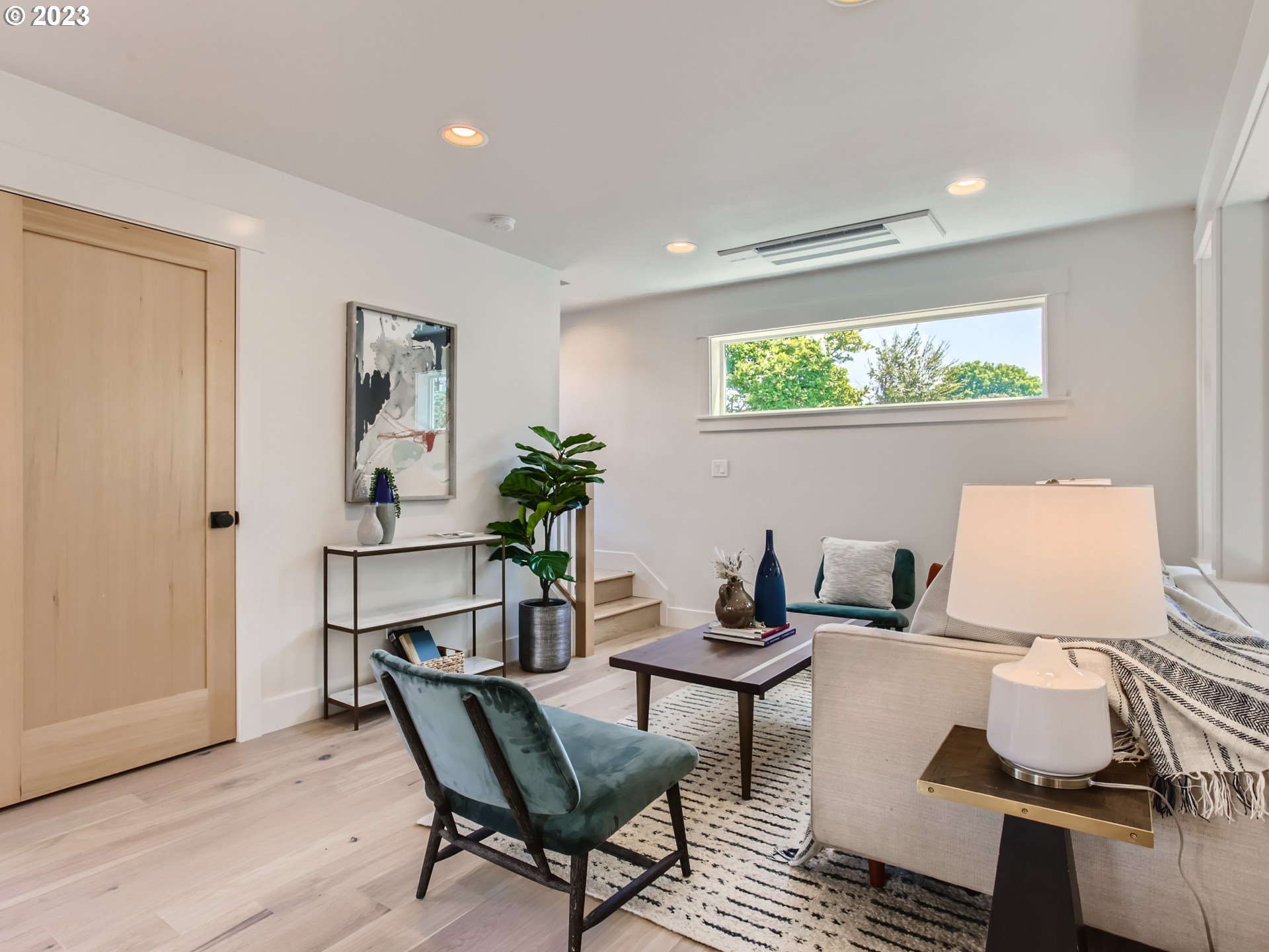 3134 North Winchell Street, Unit B Portland, OR 97217 - Photo 8 of 24 a living room with furniture and a window