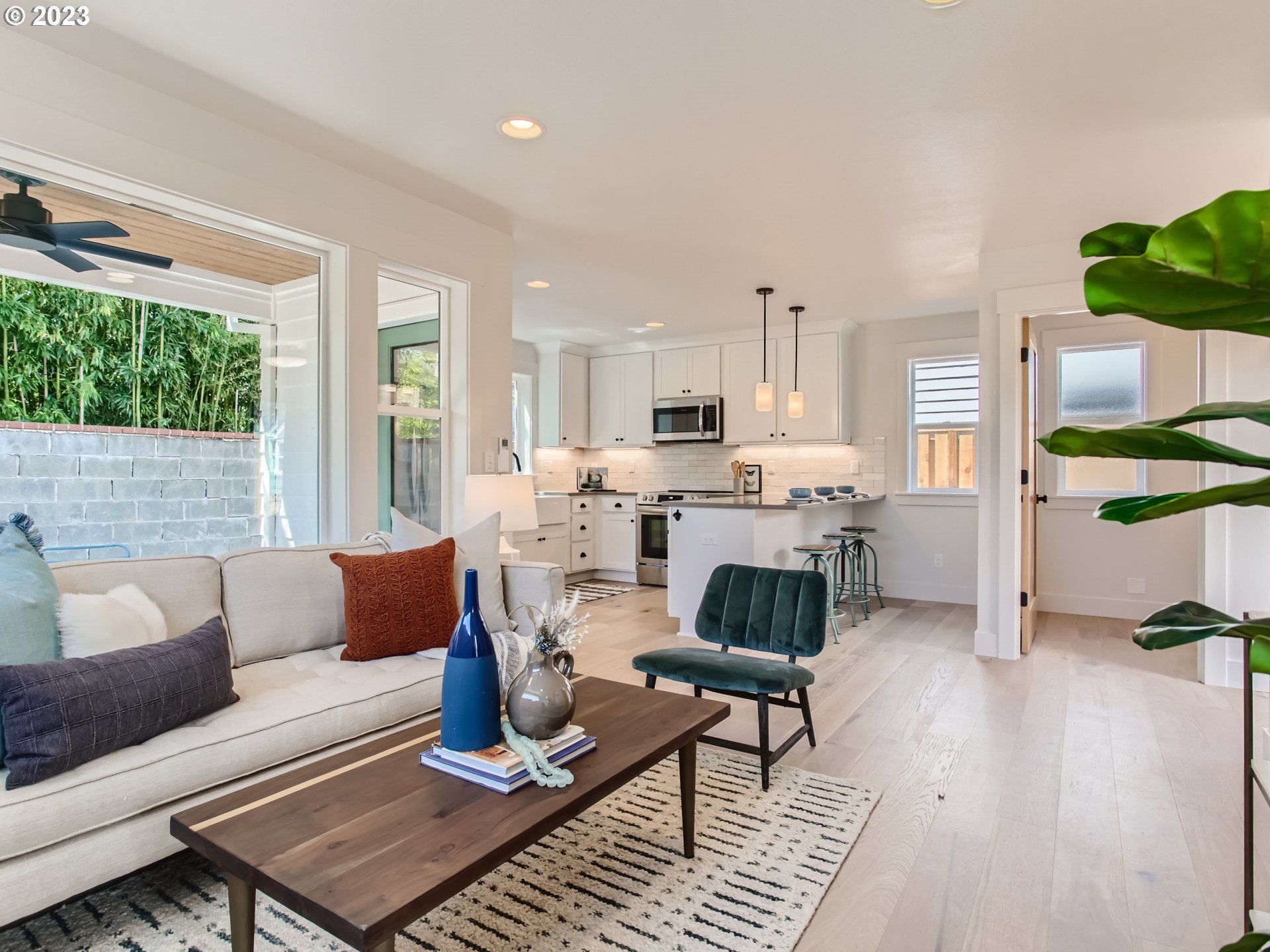 3134 North Winchell Street, Unit B Portland, OR 97217 - Photo 9 of 24 a living room with furniture and a fireplace