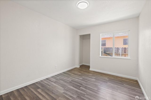 a view of room with wooden floor