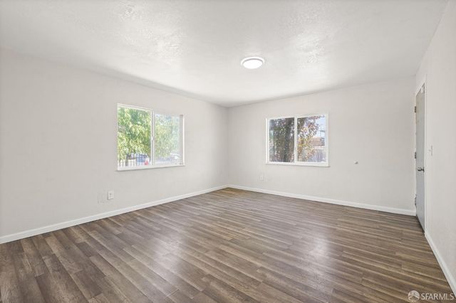 a kitchen with a sink cabinets and a window