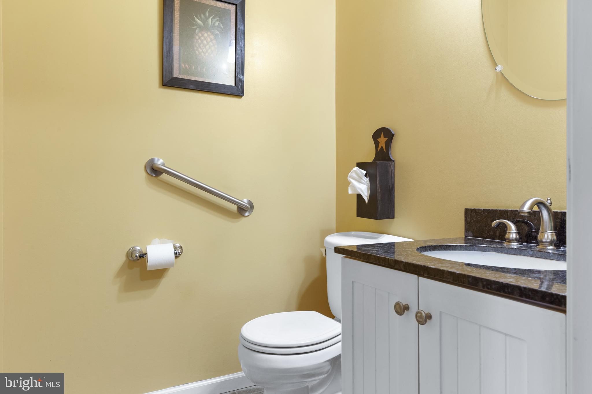81 Richards Road Bridgeton, NJ 08302 - Photo 40 of 56 a bathroom with a granite countertop sink a mirror and a toilet