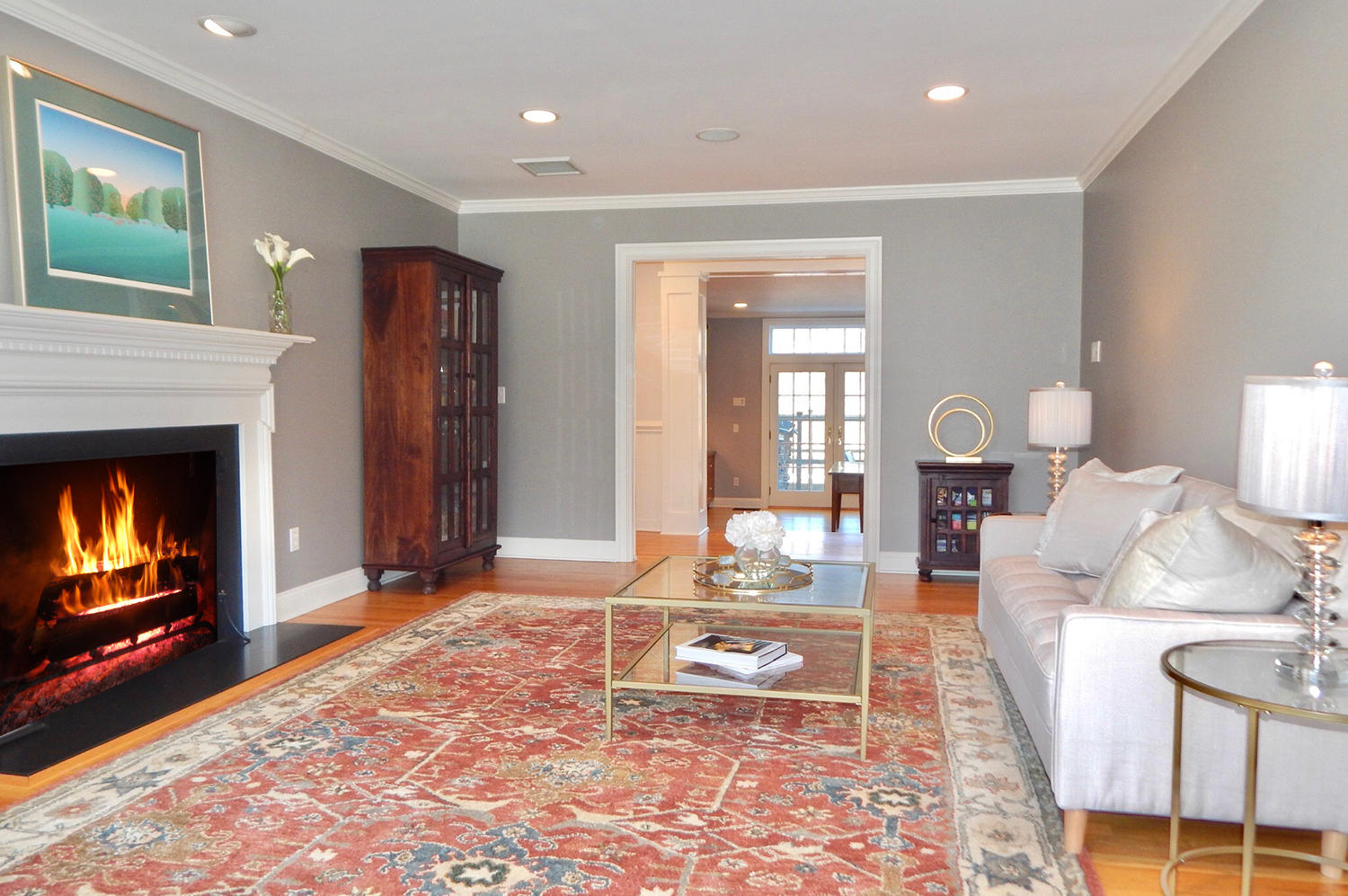 14 Chasmars Pond Road Darien, CT 06820 - Photo 11 of 34 a living room with furniture and a fireplace
