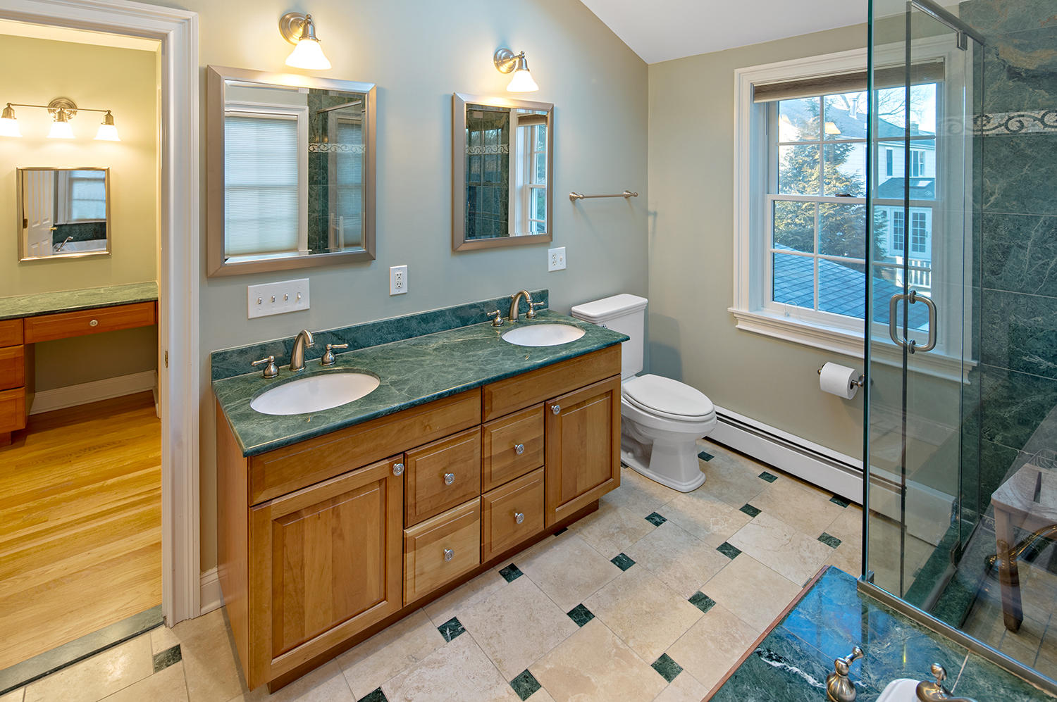 14 Chasmars Pond Road Darien, CT 06820 - Photo 20 of 34 a bathroom with a double vanity sink mirror and toilet