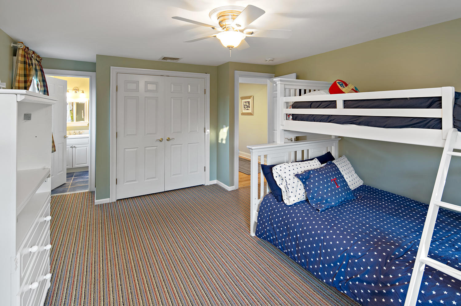 14 Chasmars Pond Road Darien, CT 06820 - Photo 22 of 34 a bedroom with a bed and wooden floor