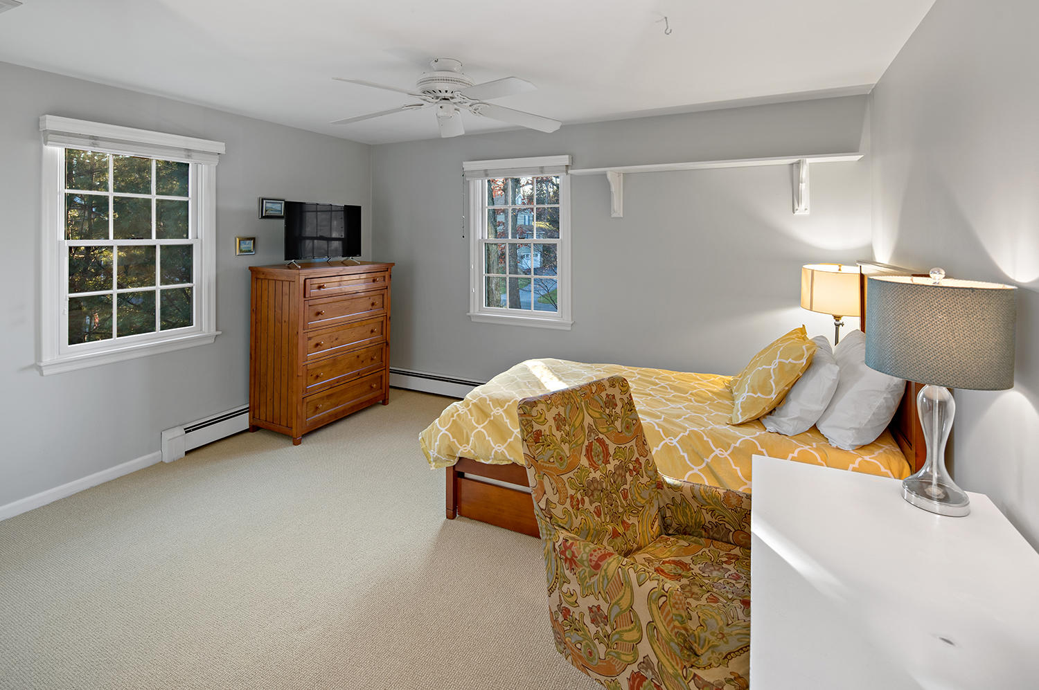 14 Chasmars Pond Road Darien, CT 06820 - Photo 24 of 34 a bedroom with a bed and a window
