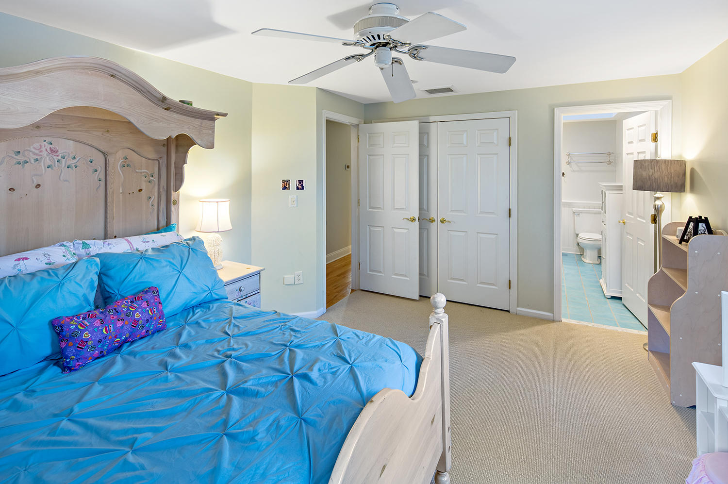 14 Chasmars Pond Road Darien, CT 06820 - Photo 25 of 34 a bedroom with a bed and a chandelier