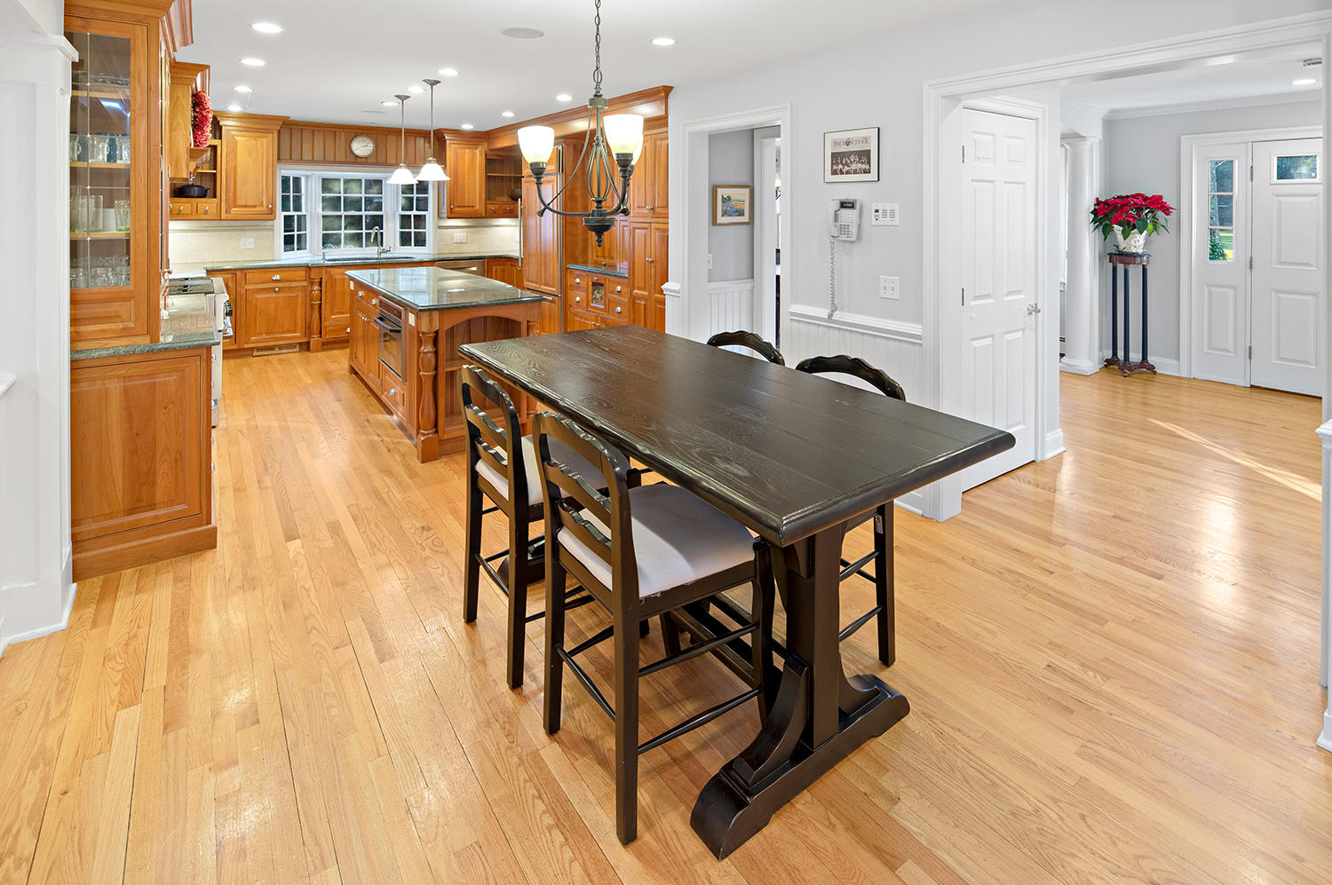 14 Chasmars Pond Road Darien, CT 06820 - Photo 4 of 34 a view of a dining room with furniture and wooden floor