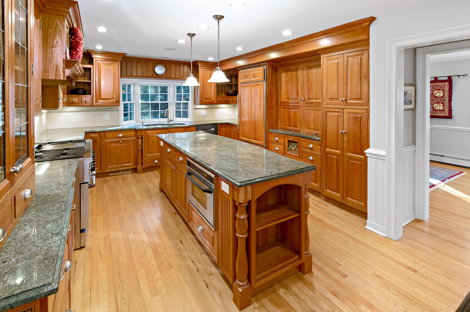14 Chasmars Pond Road Darien, CT 06820 - Photo 5 of 34 a kitchen with stainless steel appliances granite countertop a stove and a wooden floors