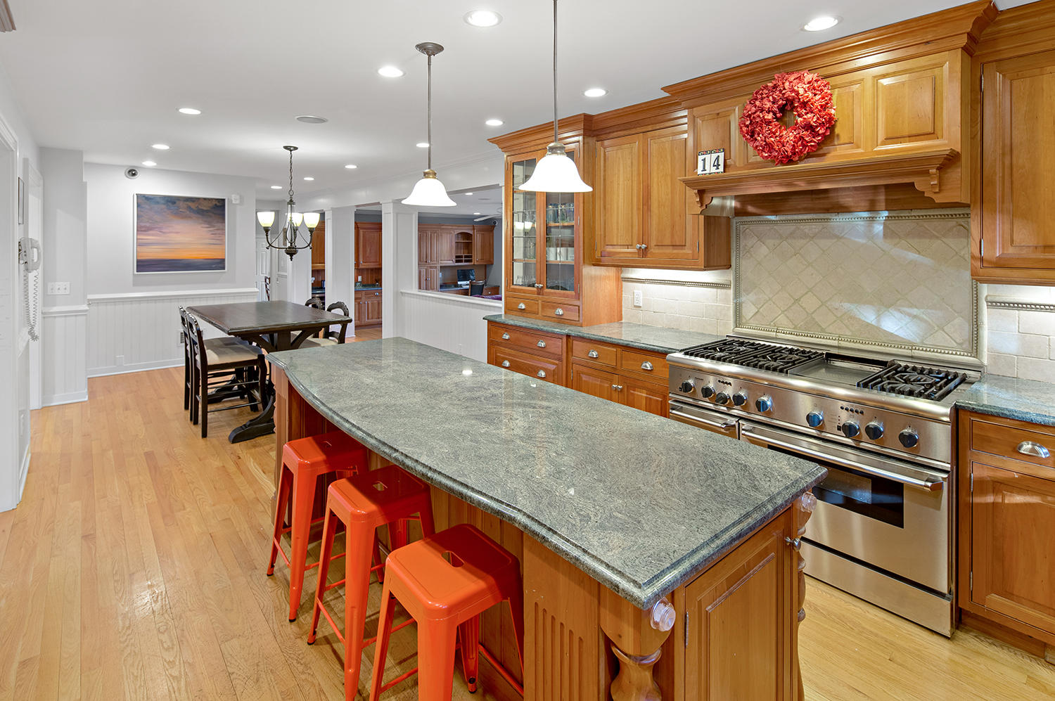 14 Chasmars Pond Road Darien, CT 06820 - Photo 6 of 34 a kitchen with stainless steel appliances granite countertop a stove and a table