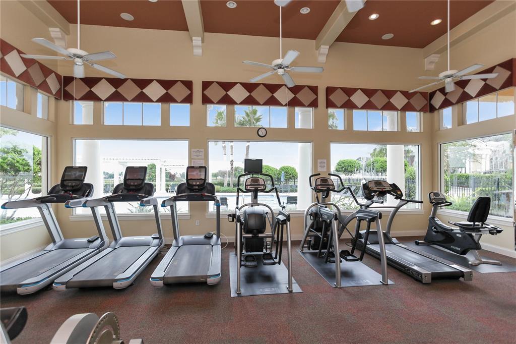 5152 Bridgehaven Road Davenport, FL 33837 - Photo 21 of 38 a room with gym equipment and a large window