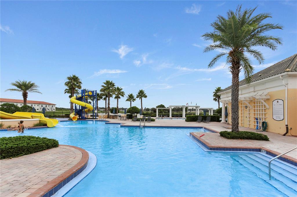 5152 Bridgehaven Road Davenport, FL 33837 - Photo 22 of 38 a swimming pool with outdoor seating and yard