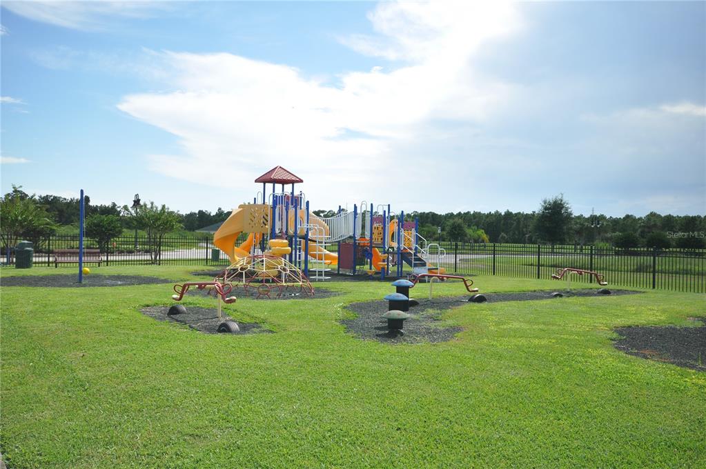 5152 Bridgehaven Road Davenport, FL 33837 - Photo 38 of 38 a view of a park with swings and slides