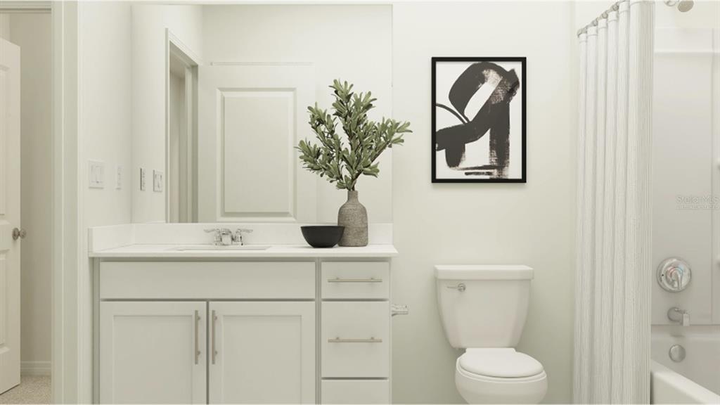 5152 Bridgehaven Road Davenport, FL 33837 - Photo 8 of 38 a bathroom with a toilet a sink and mirror