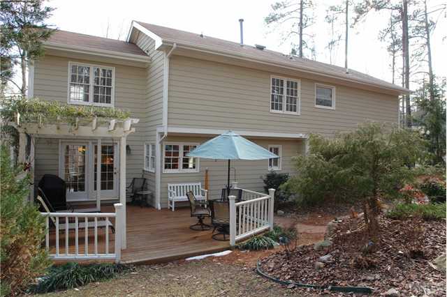 4112 Starboard Court Raleigh, NC 27613 - Photo 12 of 12 Lovely deck features trellis and views of private, wooded and landscaped back yard.