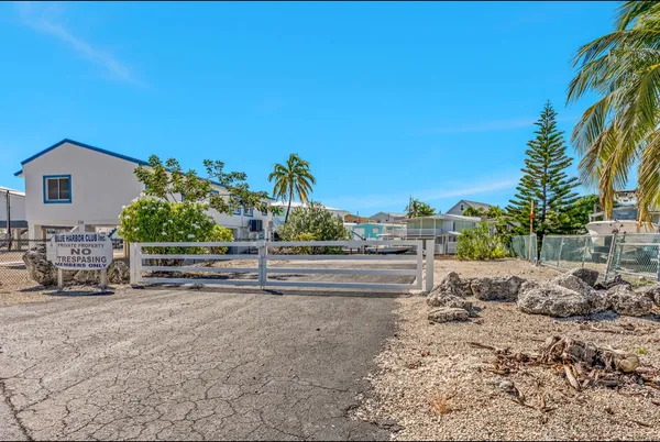 a view of a lake with boats and a chair
