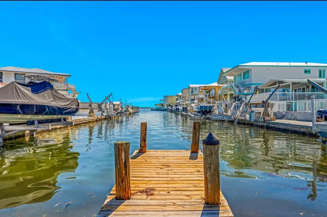 a view of a swimming pool with chairs