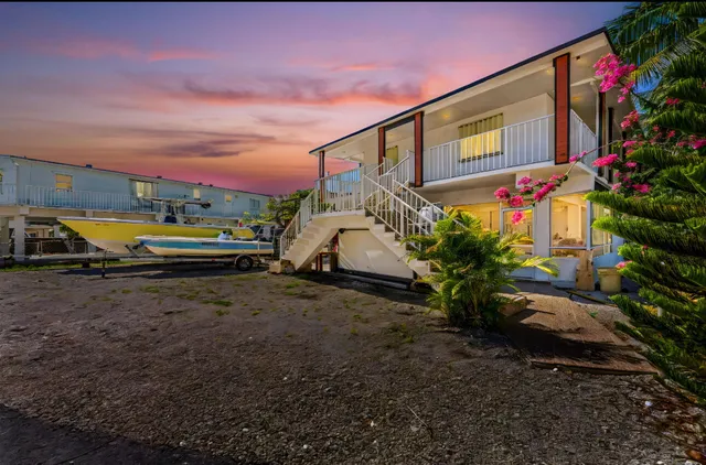 a view of a chairs and table in patio