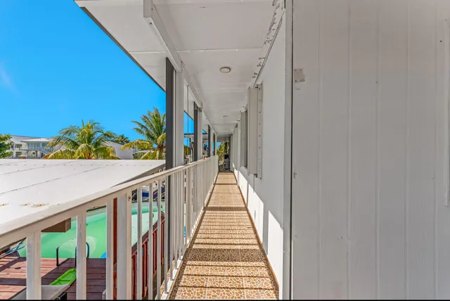 a view of a street with a building in the background